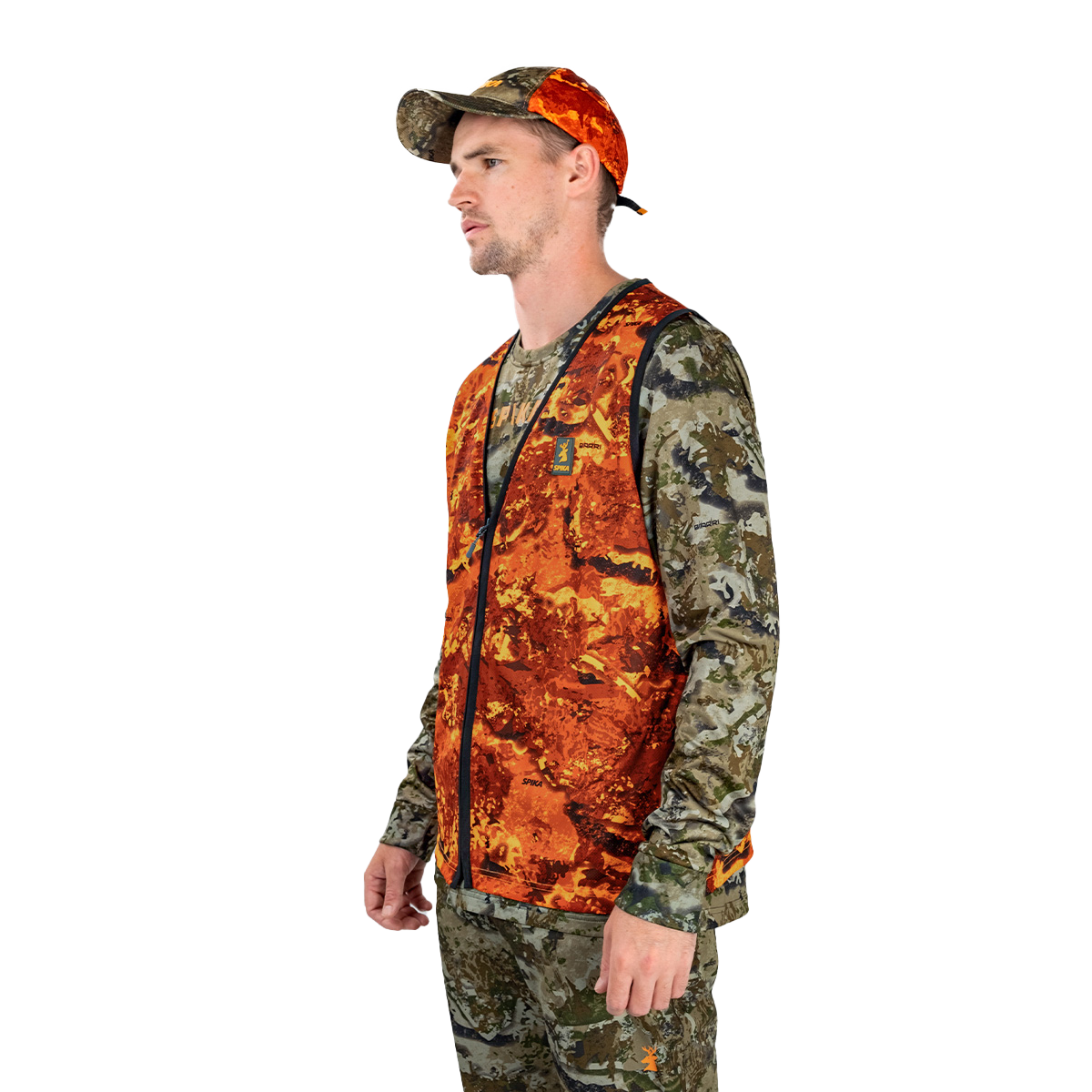 Hunter wearing the Spika Ranger vest in Biarri Blaze with a blaze cap, three-quarter view