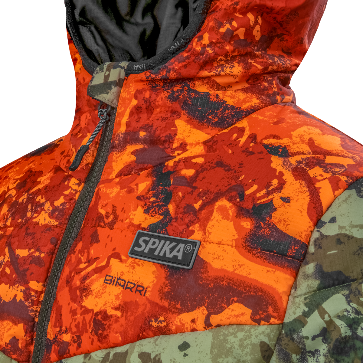 Spika Terra kids' puffer jacket in Biarri Camo/Blaze, close-up of the chest Spika badge and zip