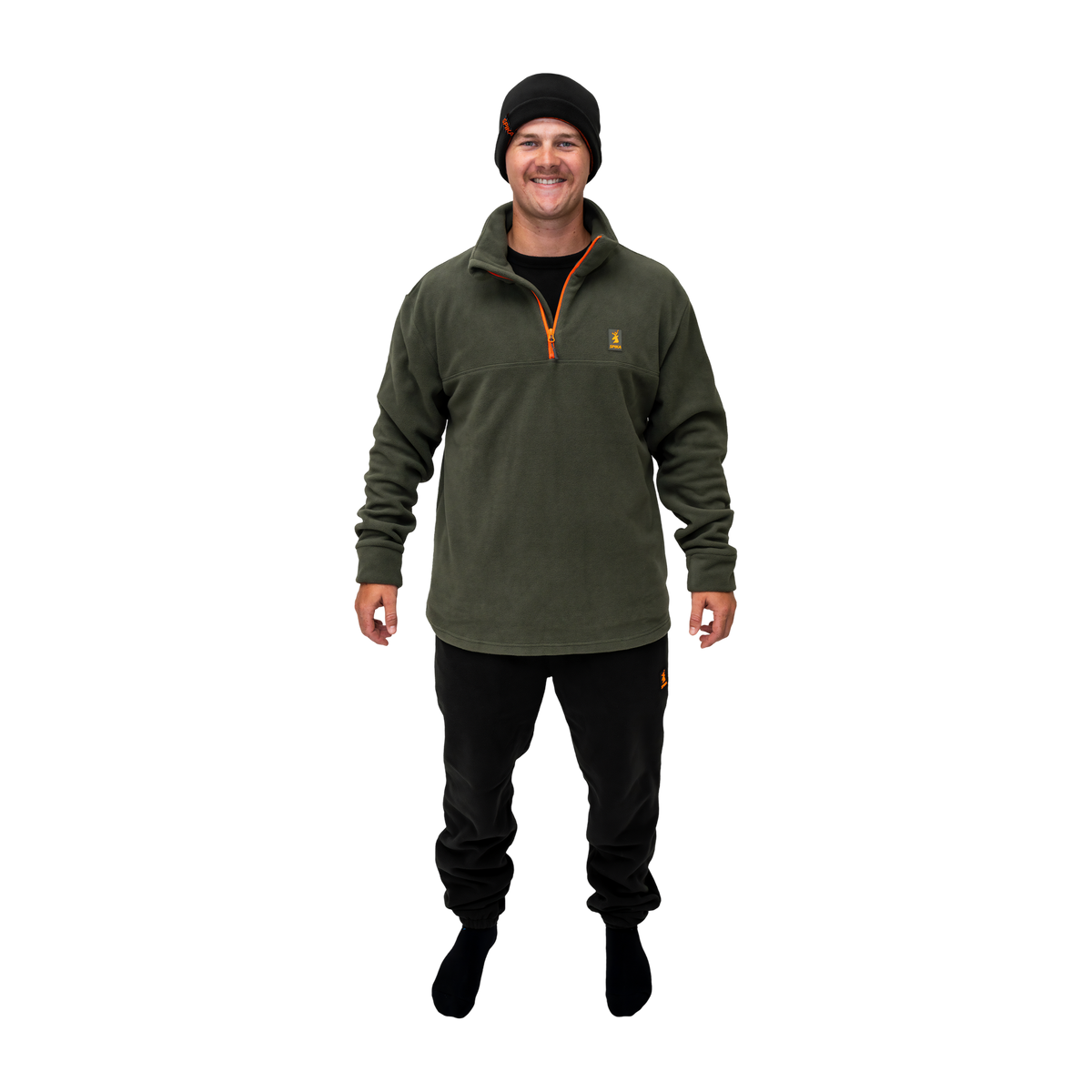 Man wearing the Spika olive quarter-zip fleece, black track pants and beanie from the 6 Piece Box Pack