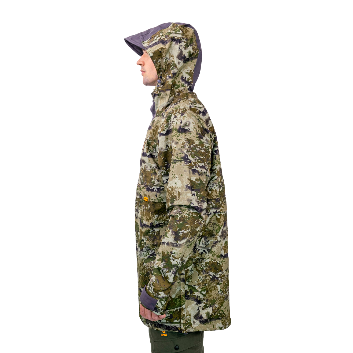 Model wearing the Spika Buckland men's Biarri Camo jacket with hood up, side profile view
