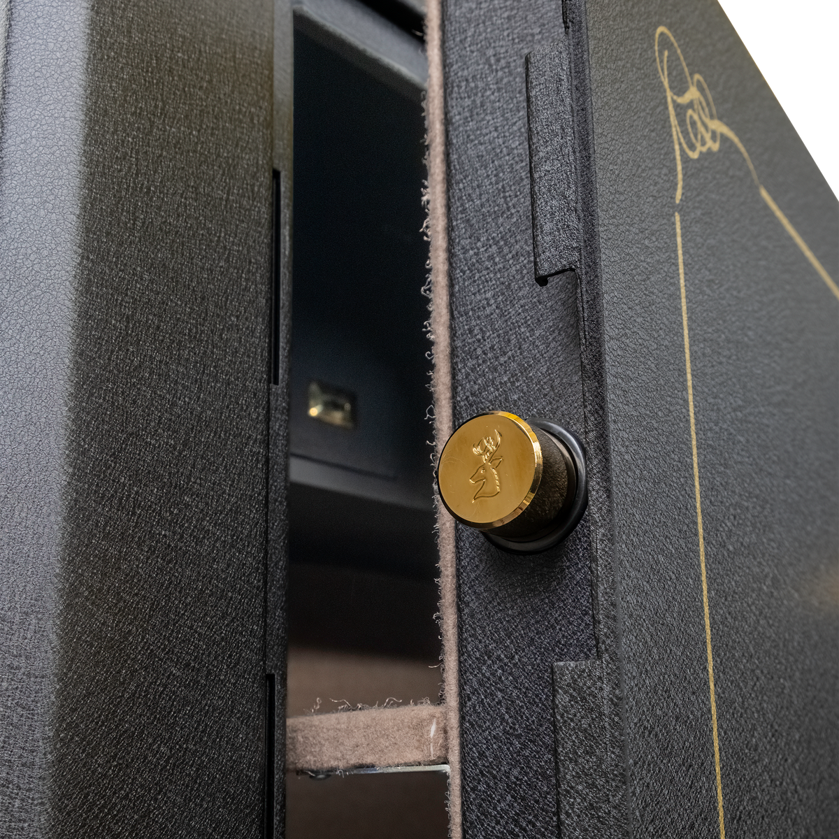 Close-up of the Spika SCH2 safe door edge with brass stag-stamped locking bolt