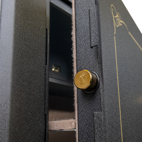 Close-up of the Spika SCH2 safe door edge with brass stag-stamped locking bolt