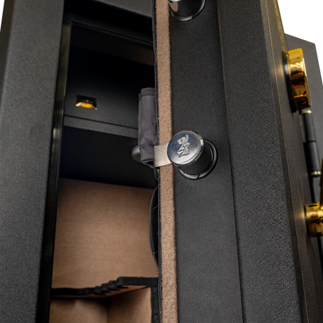 Close-up of the Spika SFB1 safe door edge with stag-stamped locking bolt and lined interior