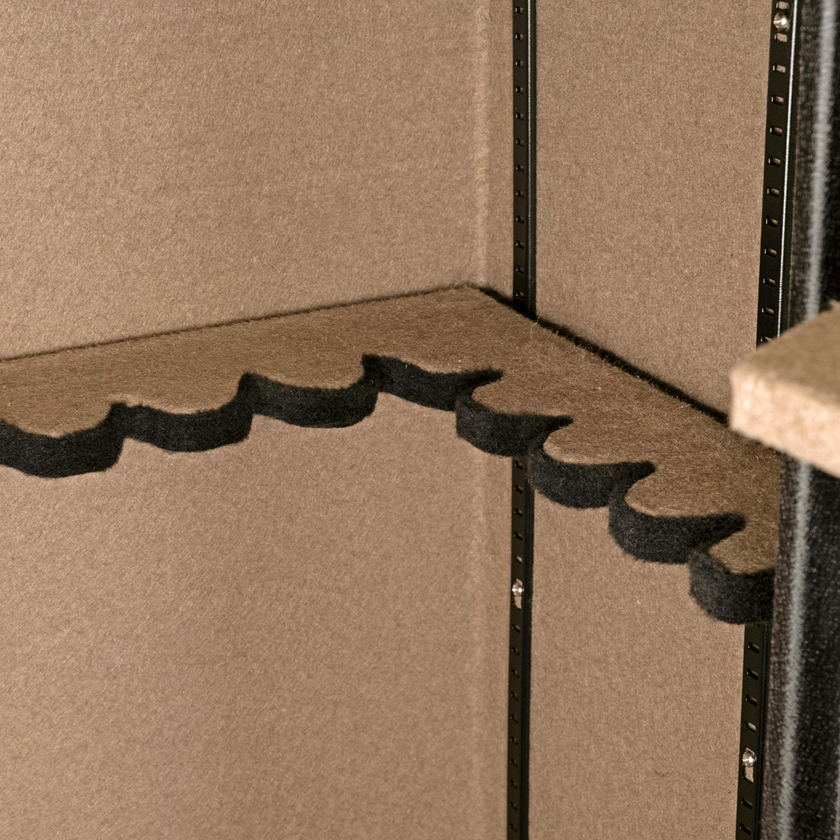 Close-up of the foam scalloped barrel rest inside a Spika premium 18-gun safe