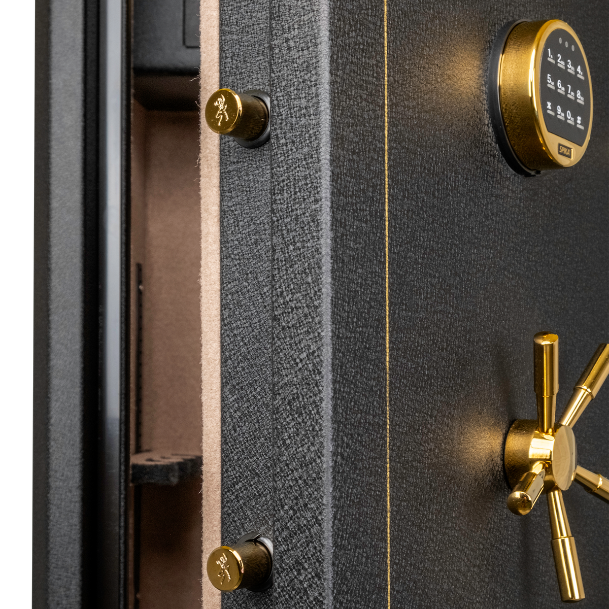 Close-up of the Spika SFABH safe keypad, brass spoke handle and locking bolts