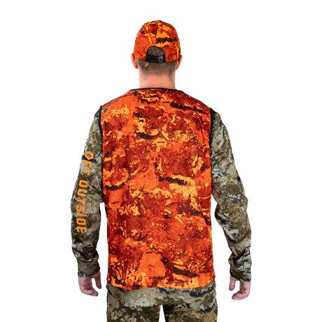 Hunter wearing the Spika Ranger vest in Biarri Blaze with a blaze cap, back view