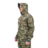 Man wearing the Spika Highpoint men's shell jacket in Biarri Camo with the hood up