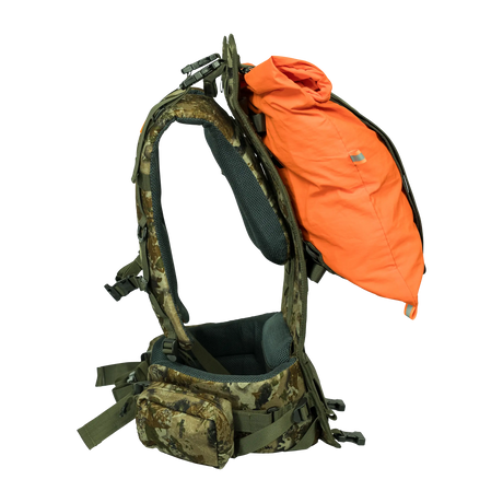 Spika Drover II Hauler frame in Biarri Camo, side view with an orange load bag held between frame and harness