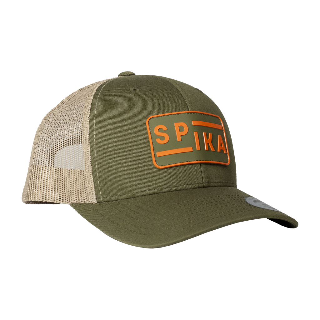 Spika Urban Waypoint trucker cap in Olive/Tan, three-quarter view with orange SPIKA patch