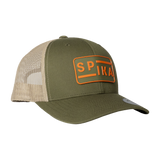 Spika Urban Waypoint trucker cap in Olive/Tan, three-quarter view with orange SPIKA patch