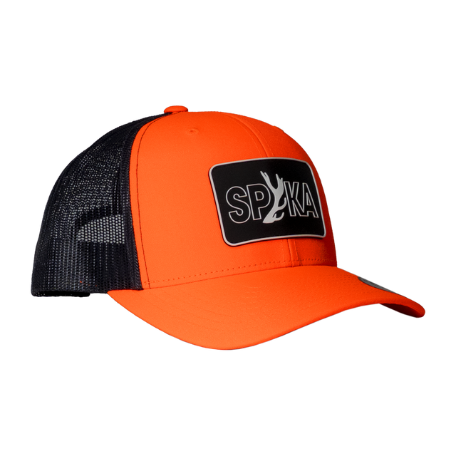 Spika Cast Antler patch trucker cap in Blaze/Charcoal, three-quarter view with mesh back