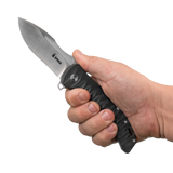 Spika Bushmaster Viper folding knife opened and held in hand to show grip size and blade