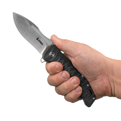 Spika Bushmaster Viper folding knife opened and held in hand to show grip size and blade