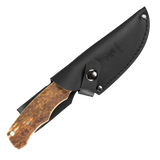 Spika Bushmaster Jeremiah knife sheathed in its black leather sheath with snap retention strap