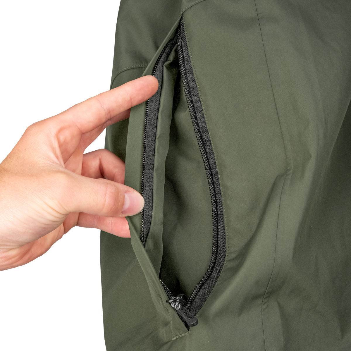 Spika Scout men's jacket in Olive, hand opening the zipped side hand-warmer pocket