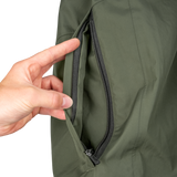 Spika Scout men's jacket in Olive, hand opening the zipped side hand-warmer pocket