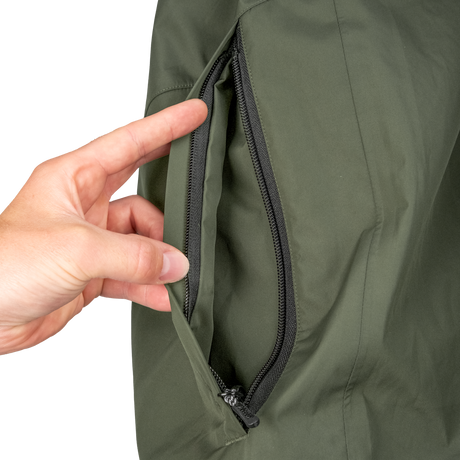 Spika Scout men's jacket in Olive, hand opening the zipped side hand-warmer pocket