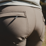 Spika Recon women's pants worn outdoors, rear close-up of back pockets and logo tab