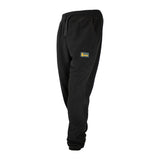 Spika GO men's tracksuit pants in Black, three-quarter view showing the Spika patch on the leg