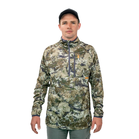 Man wearing the Spika Guide men's lightweight half-zip top in Biarri Camo, front view