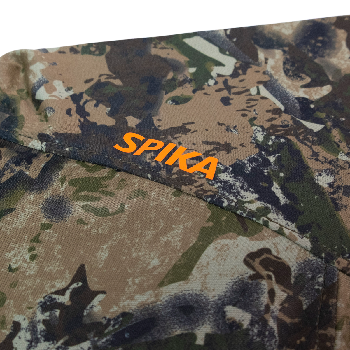 Spika Bandit youth hoodie close-up of the orange Spika logo on the Biarri Camo shoulder