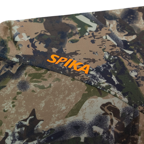 Spika Bandit youth hoodie close-up of the orange Spika logo on the Biarri Camo shoulder
