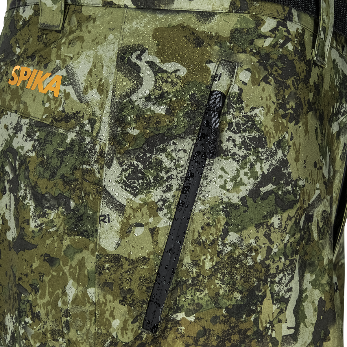 Spika Edge men's Biarri Camo pants close-up of the waterproof zip thigh pocket and orange logo