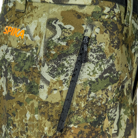Spika Edge men's Biarri Camo pants close-up of the waterproof zip thigh pocket and orange logo