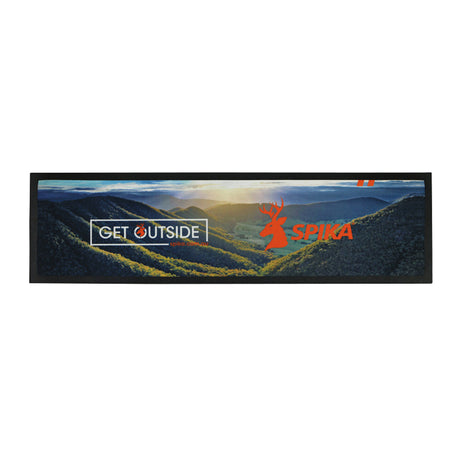 Spika Get Outside rubber bar mat printed with a mountain valley scene and Spika branding