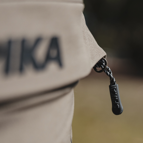 Spika Recon women's pants, close-up of the braided zip pull on the cargo pocket