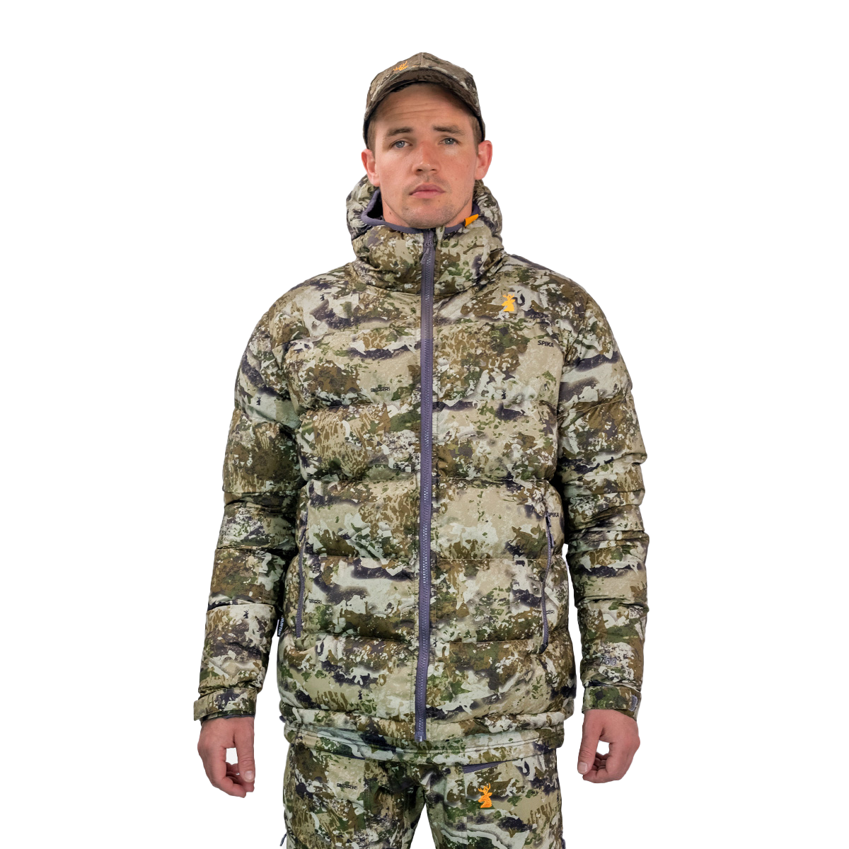 Man modelling the Spika Terra men's puffer jacket in Biarri Camo with a matching cap, front view