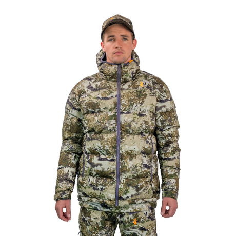 Man modelling the Spika Terra men's puffer jacket in Biarri Camo with a matching cap, front view