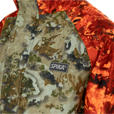 Spika Valley kids' jacket in Biarri Camo/Blaze, close-up of the Spika chest badge and storm flap