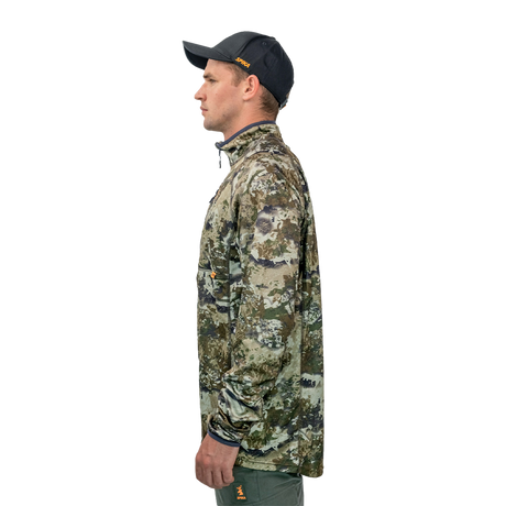 Man wearing the Spika Guide men's lightweight top in Biarri Camo, side profile view