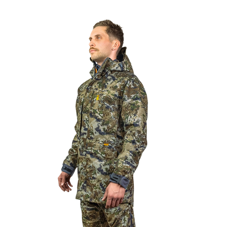 Man modelling the Spika Stalker men's hunting jacket in Biarri Camo, three-quarter front view