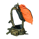 Spika Drover II Hauler frame in Biarri Camo, side view carrying an orange load bag between frame and harness