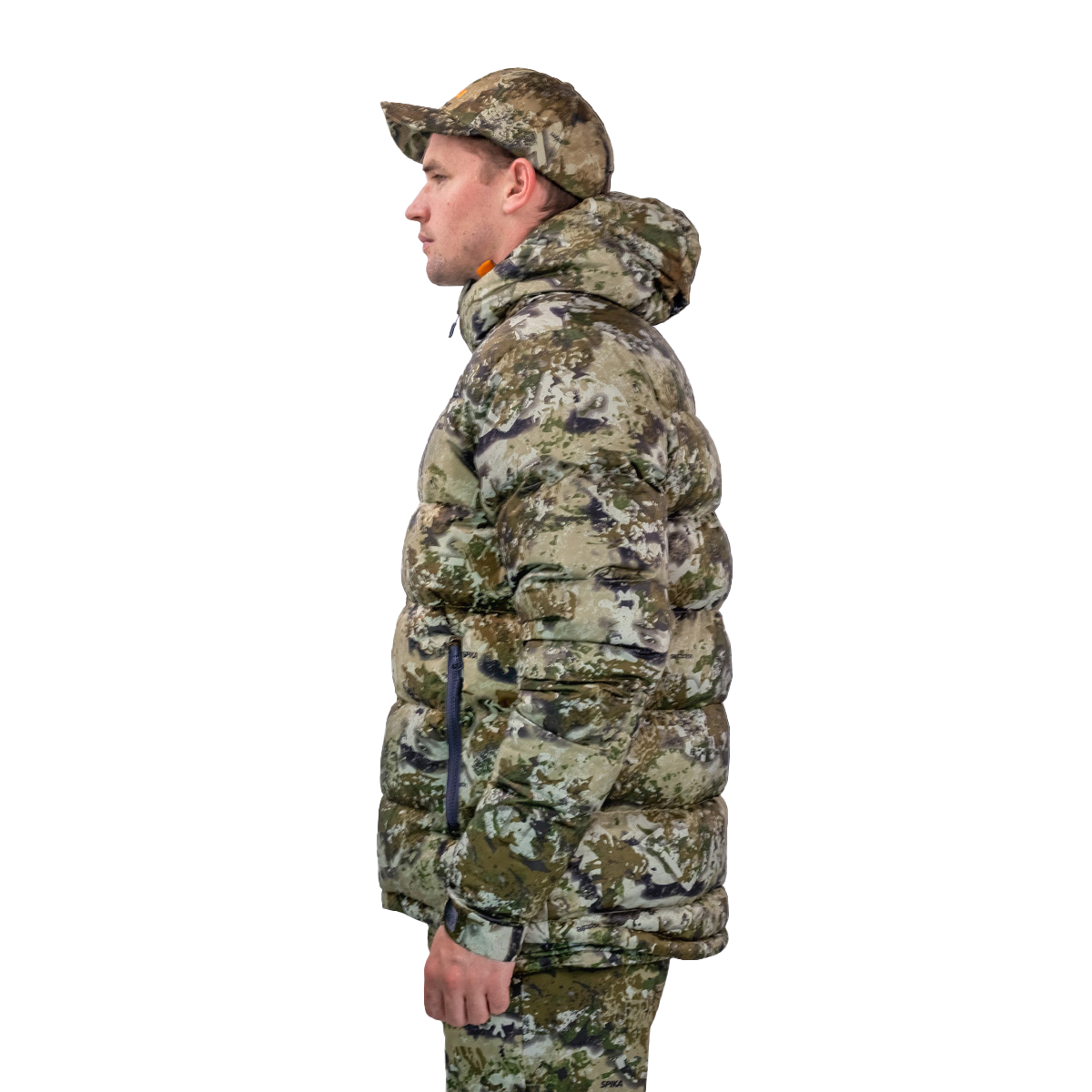 Man modelling the Spika Terra men's puffer jacket in Biarri Camo, side profile view