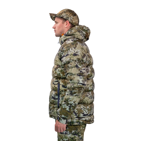 Man modelling the Spika Terra men's puffer jacket in Biarri Camo, side profile view