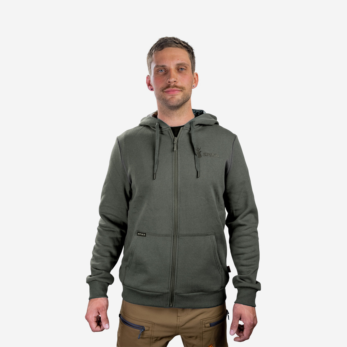 Man wearing the Spika GO Core men's olive zip-through hoodie with tan pants, front view