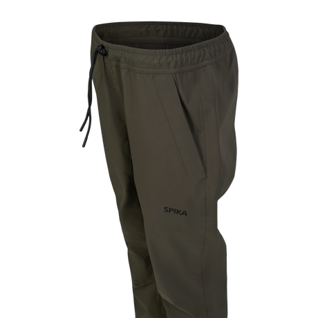 Spika Reign women's pants in Olive Summit, close-up of the waistband, drawcord and hand pocket
