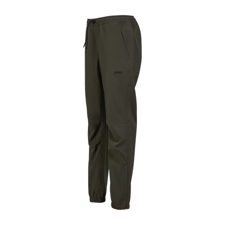 Spika Reign women's pants in Olive Summit, three-quarter view showing the SPIKA hip print