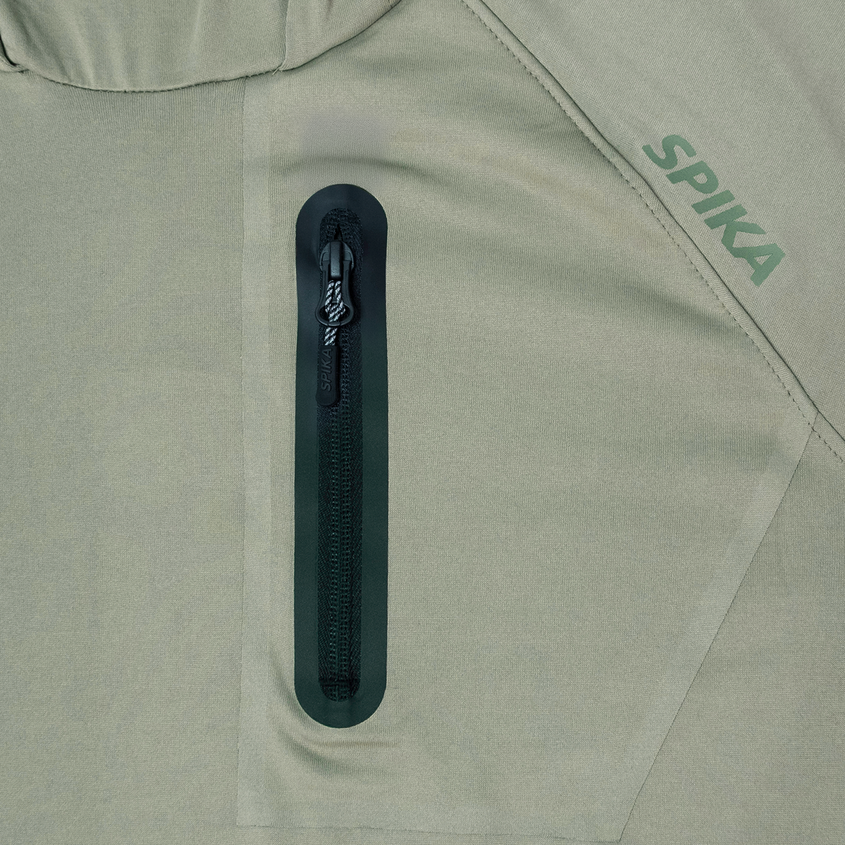 Spika Bandit women's Moss Green hoodie close-up of the zipped chest pocket and tonal Spika logo