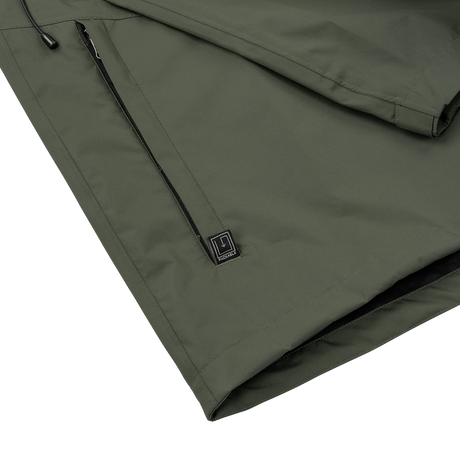 Spika Scout men's jacket in Olive, close-up of the zipped lower pocket and hem logo tab