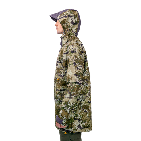 Model wearing the Spika Buckland men's Biarri Camo jacket with hood up, side profile view