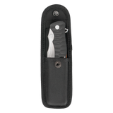 Spika Bushmaster Viper folding knife sitting in its open black nylon belt pouch, flap lifted