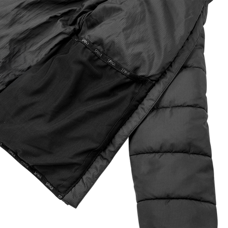 Spika Terra kids' puffer jacket in Black, opened to show the inner lining with Spika taping