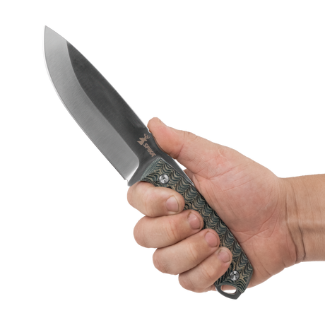 Spika Bushmaster Dogtooth fixed blade knife held in hand to show grip fit and blade length