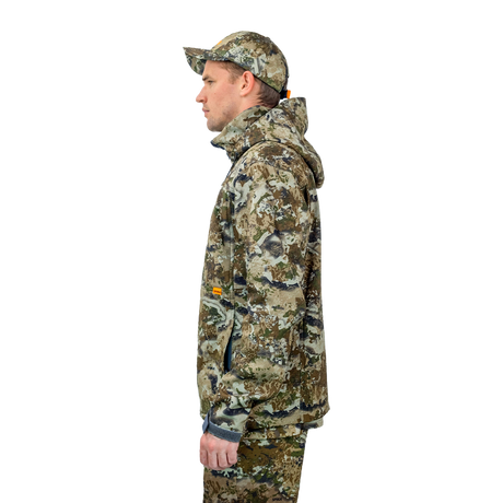 Man wearing the Spika Highpoint men's shell jacket in Biarri Camo, side profile view