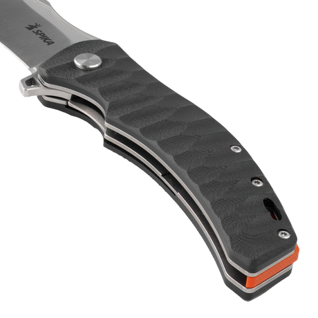 Close-up of the Spika Bushmaster Viper handle front, wave-textured scale, pivot and steel liners