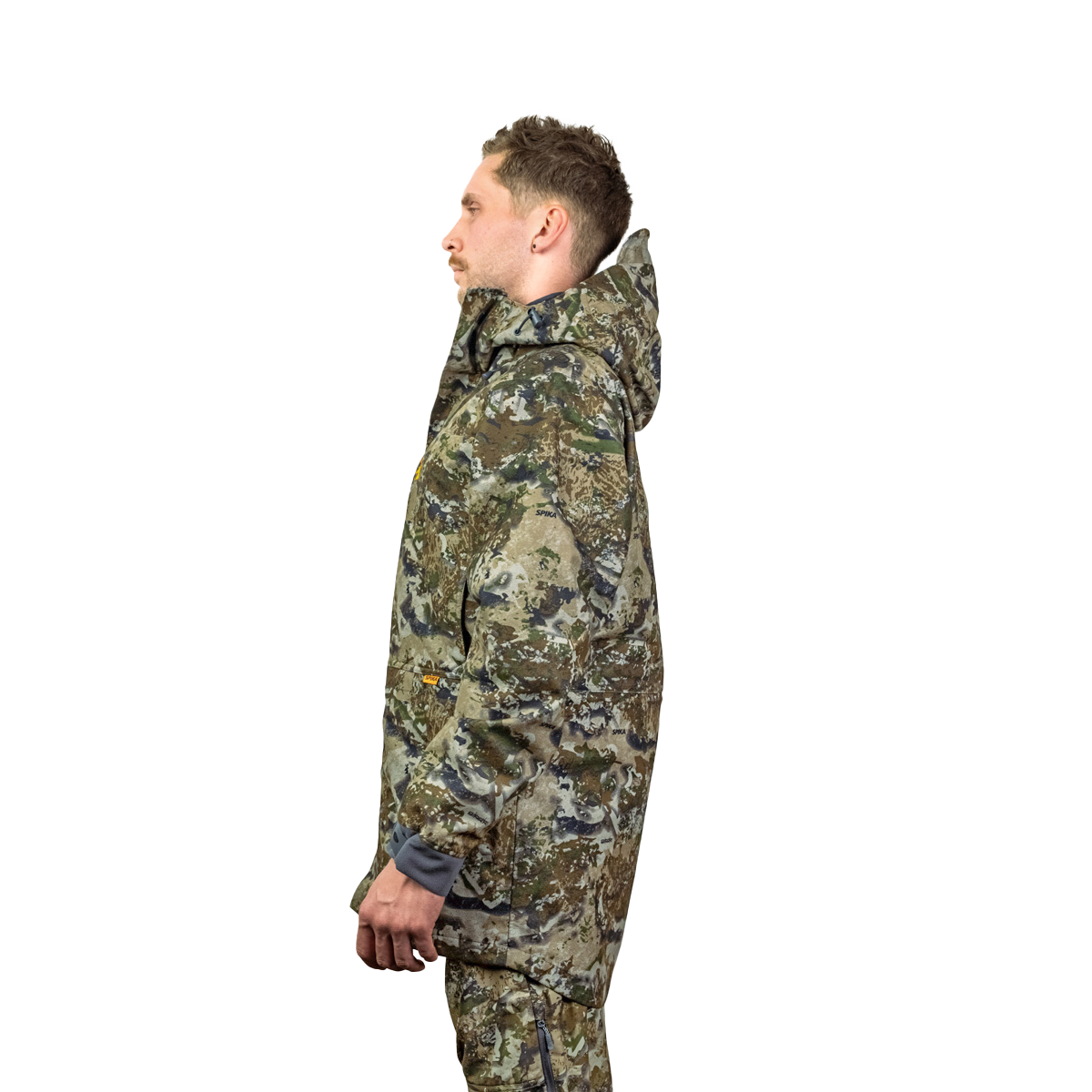 Man modelling the Spika Stalker men's hunting jacket in Biarri Camo, side profile view